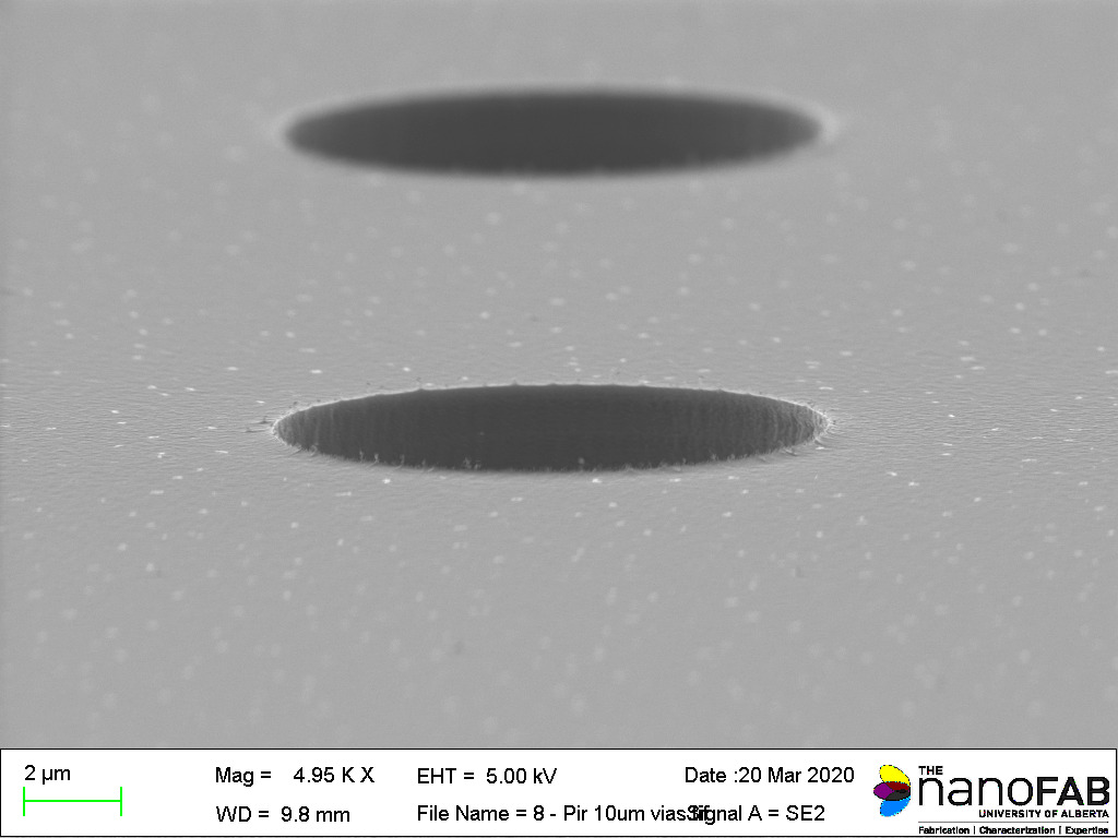 Stripping process: 30 min in self-heated 3:1 H₂SO₄:H₂O₂ piranha Structure: 10 µm vias