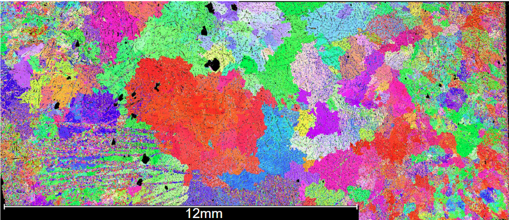Electron backscatter diffraction map showing crystalline grain structures in various colors, with a 12mm scale bar at the bottom.